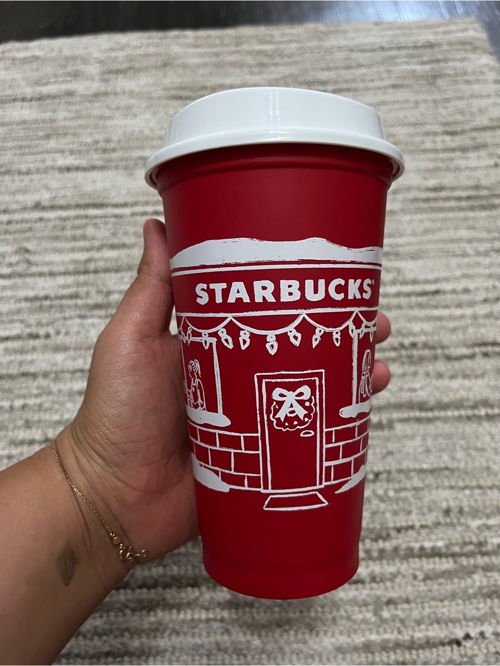 Starbucks Red Holiday Cup with White Lid and Festive White Illustration